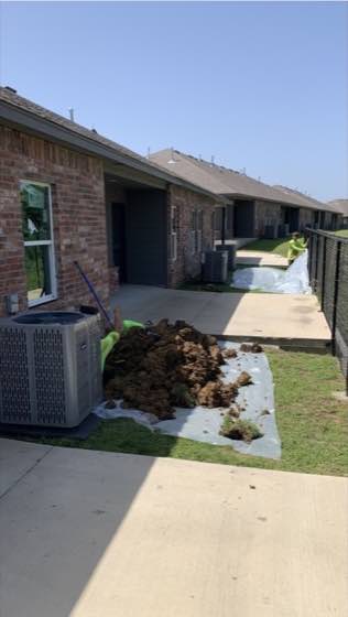 Exterior project preparation beside a home